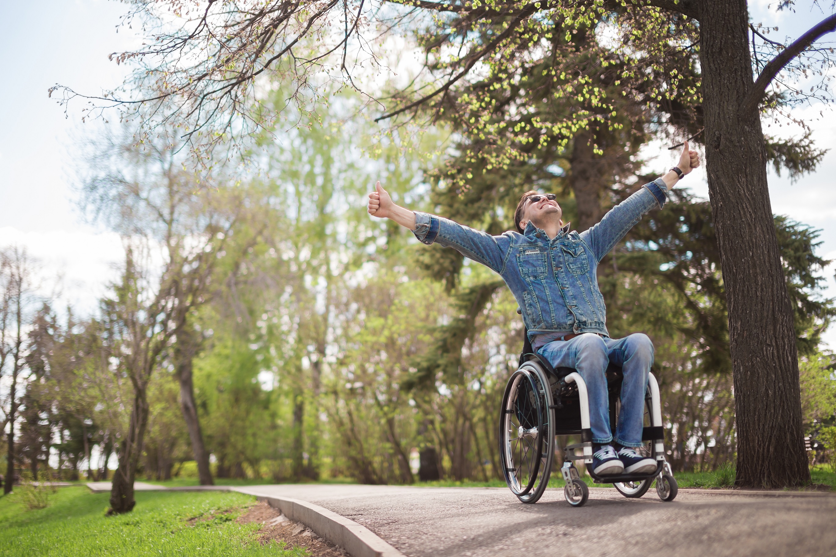Person using a wheelchair accessing a public space